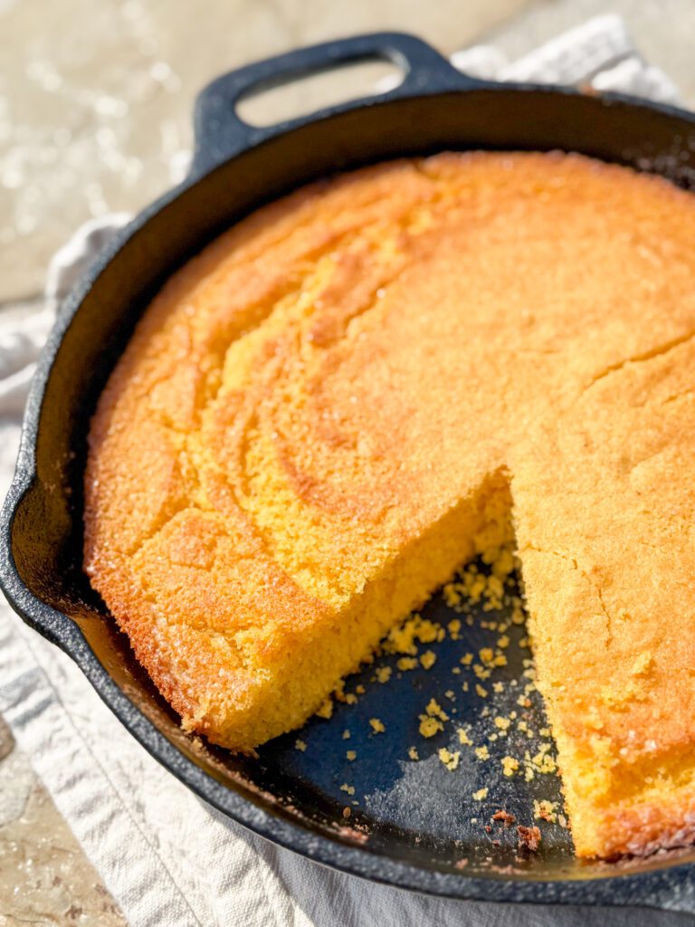 The best cornbread recipe (made in a cast iron skillet) — crispy golden edges, buttery soft inside, and baked to perfection with Kerrygold butter. Easy Southern cornbread made with self-rising cornmeal mix, buttermilk, and baked in cast iron for authentic flavor. Perfect with chili, beans, or Hamburger Soup!